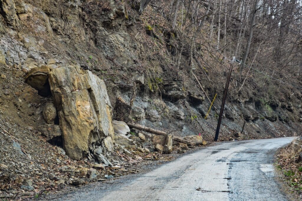 A photo of a massive builder resting on a road in Marshall County.