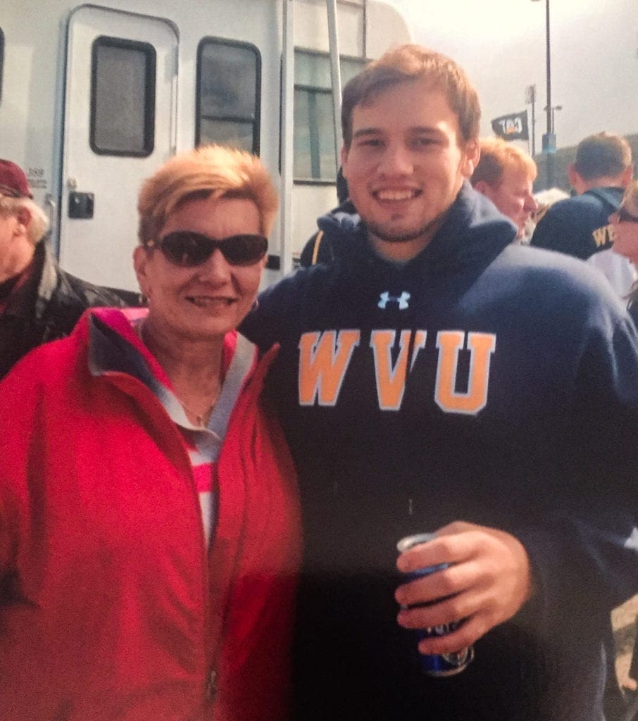 A son and mother at a WVU tailgate party.