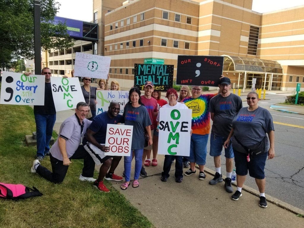 A group of folks picketing near downtown Wheeling.