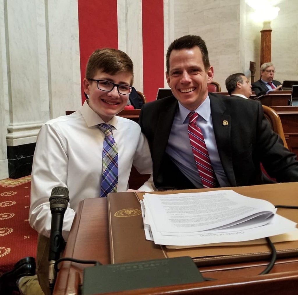 A father and son in the Senate chambers.