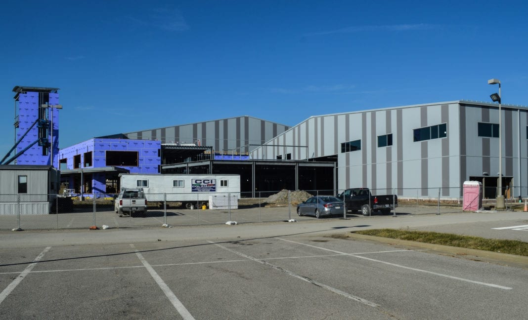 A photo of a large shell building under construction.