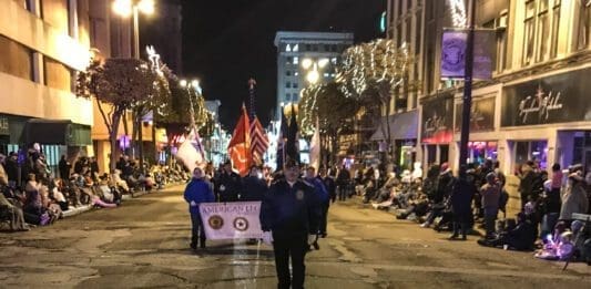 The Americans Legion Post 1 Color Guard leads the Wheeling parade.