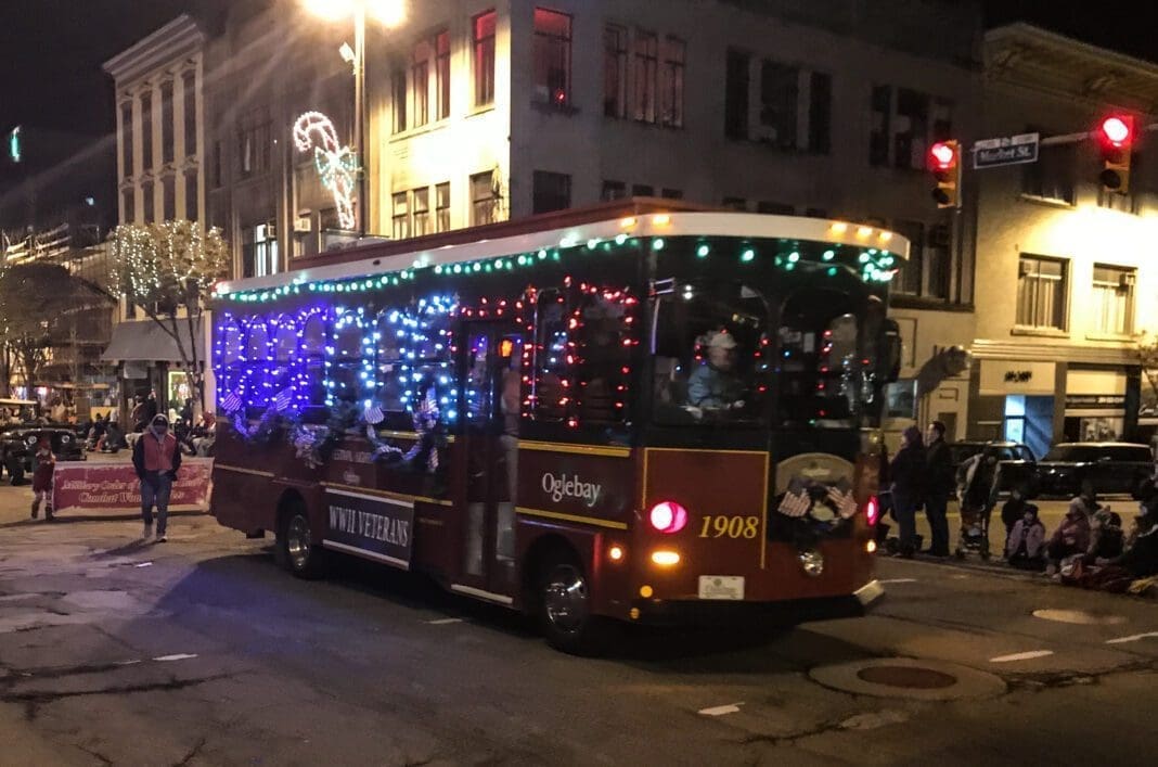 A trolley carrying WWII veterans.