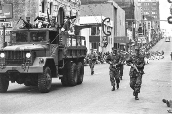 A military transport vehicle and local reservists.