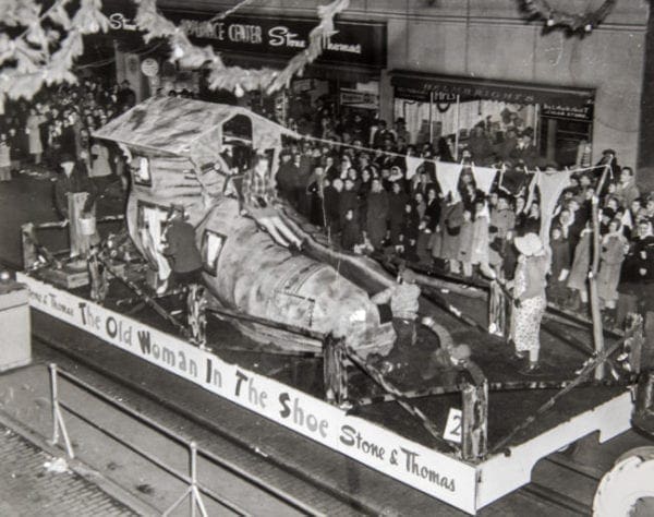 A parade float that has the "Old Woman in the Shoe."