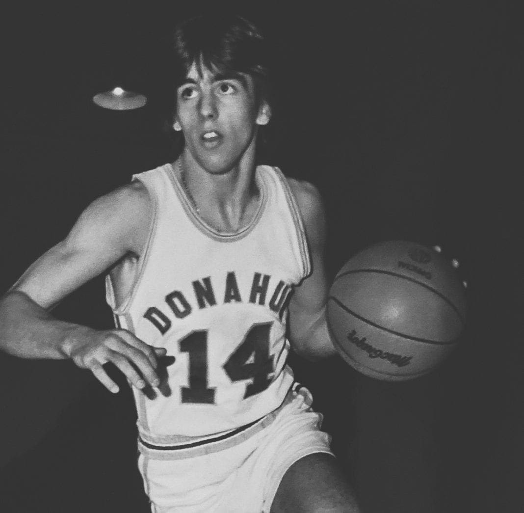 A black and white photo of a basketball player.