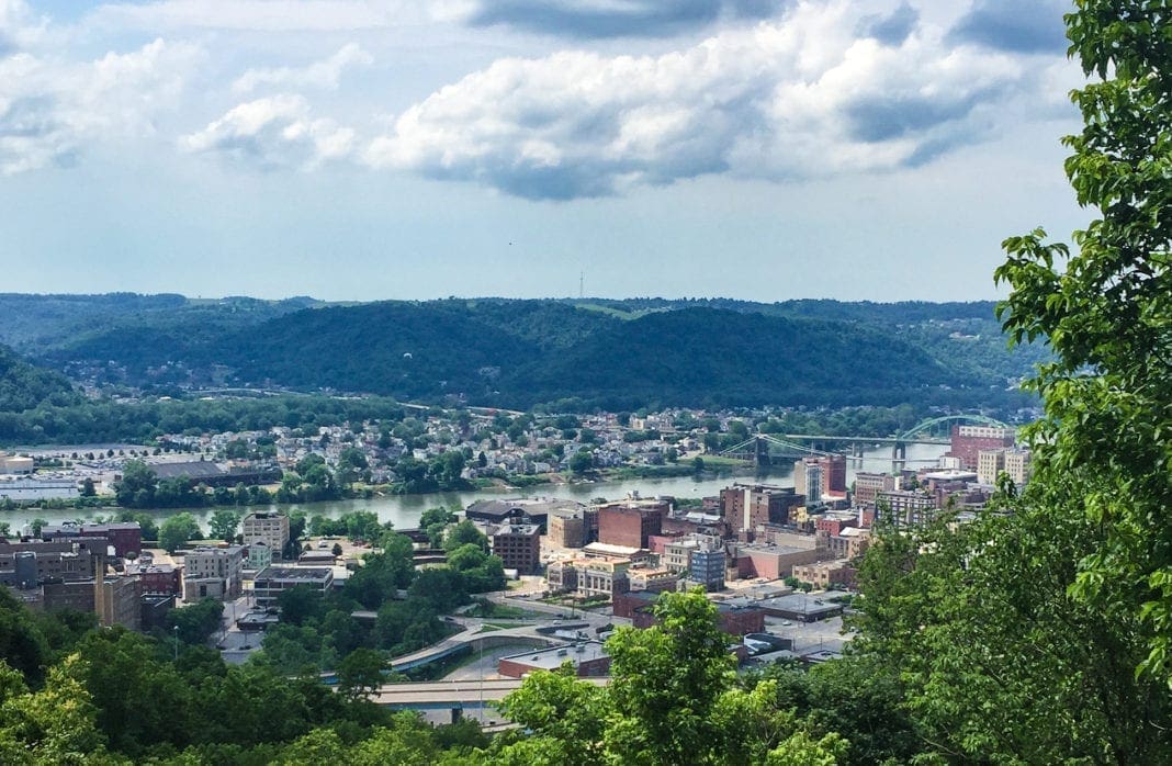 A photo of a downtown taken from a hillside above.