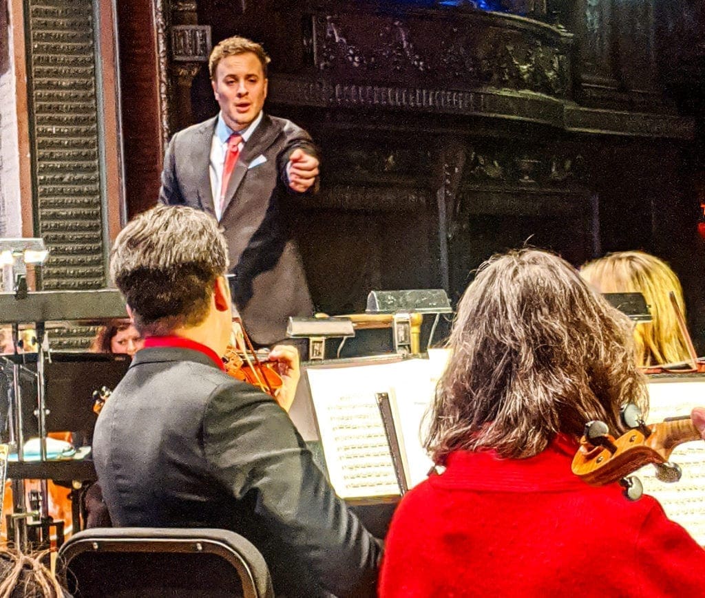 A back stage photo of an orchestra.