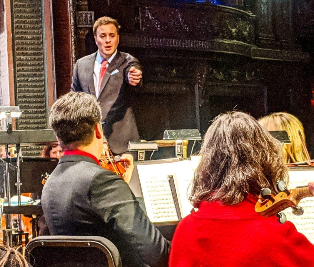 A back stage photo of an orchestra.