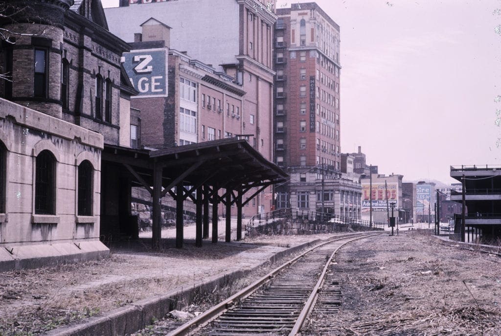 A photo at the base of train tracks.