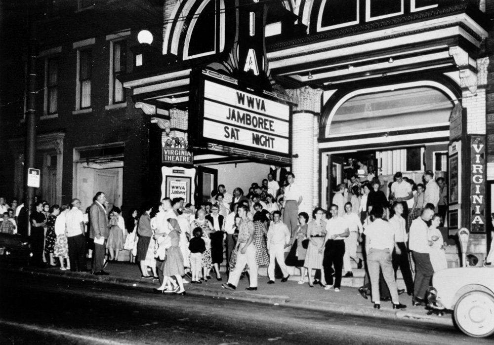 A large crowd outside a theatre.