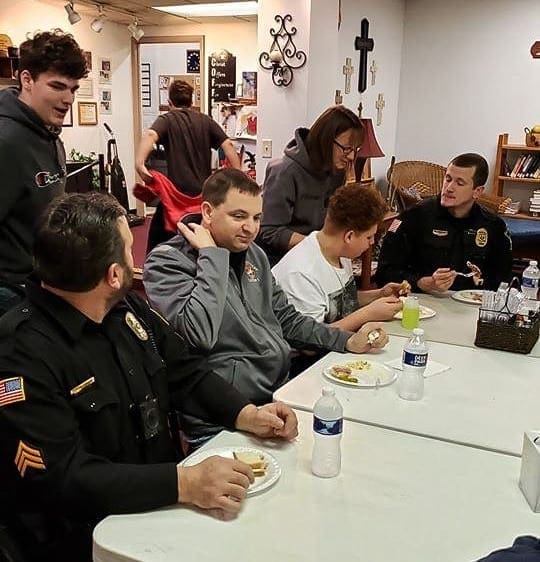 A photo of people having a meal.