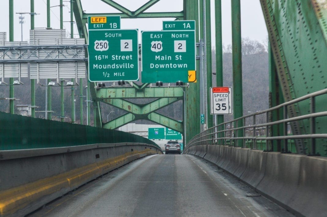 A slim road on a bridge.