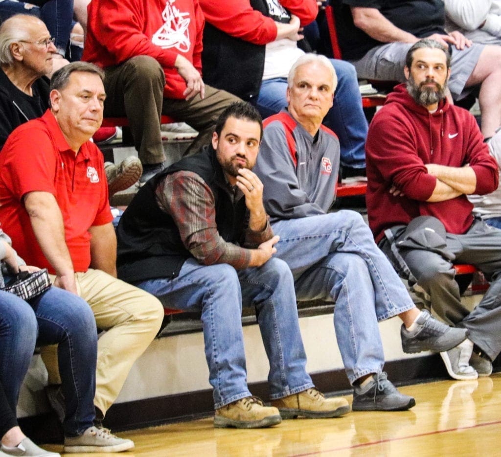 A retired coach watching a game.