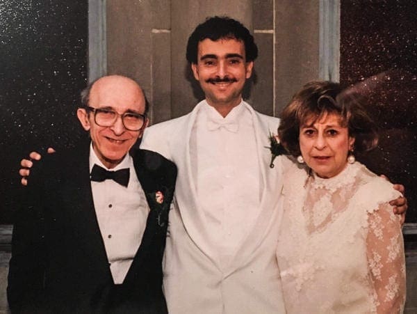 George Kellas with his parents on his wedding day.