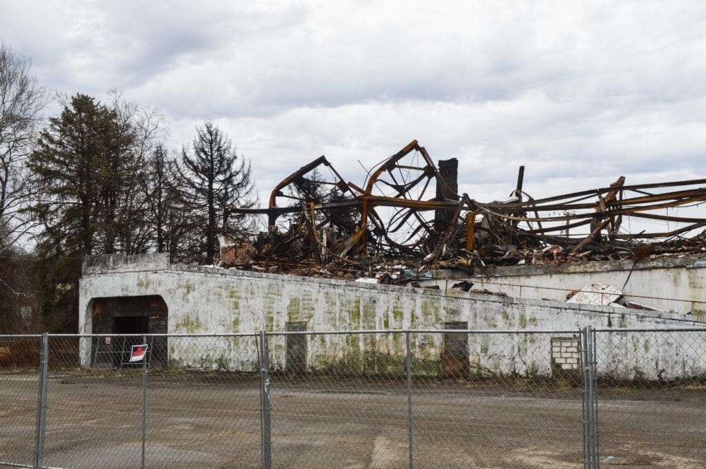 A fenced off area where a fire took place.