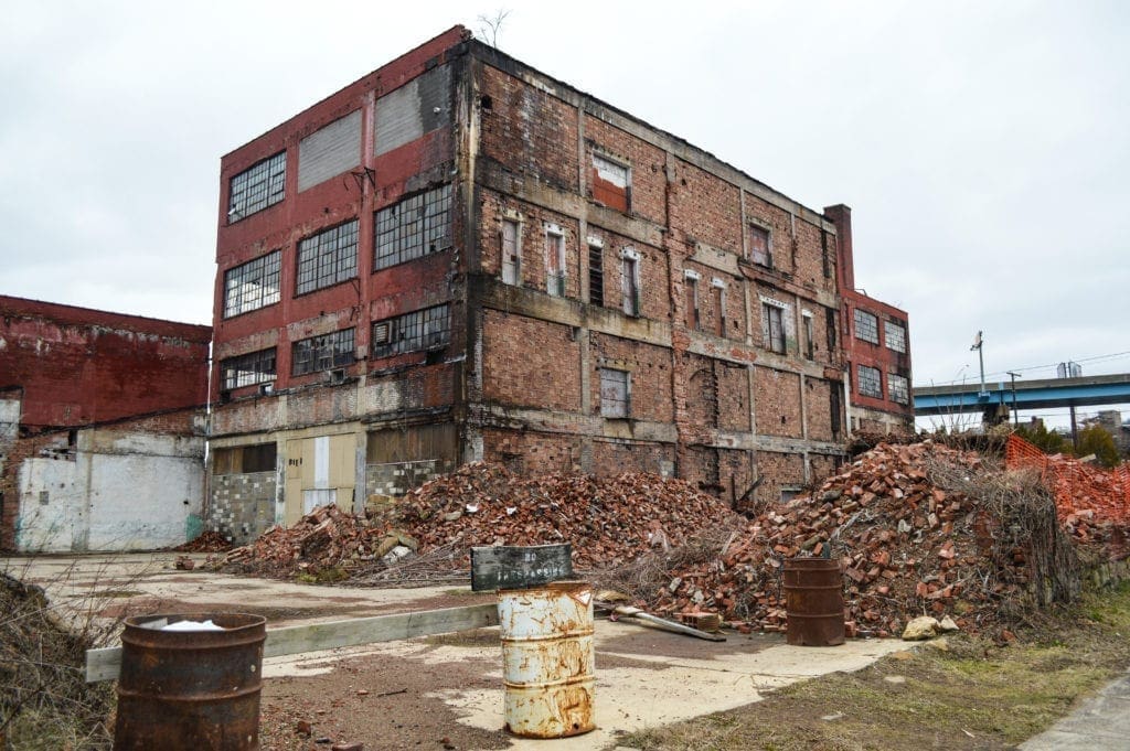 A photo of a large dilapidated building.