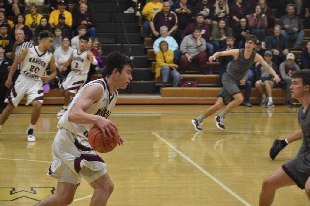 Wheeling Central player running down the court.