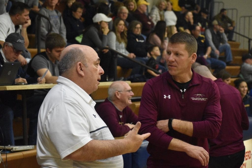 Two coaches talking before the big game.