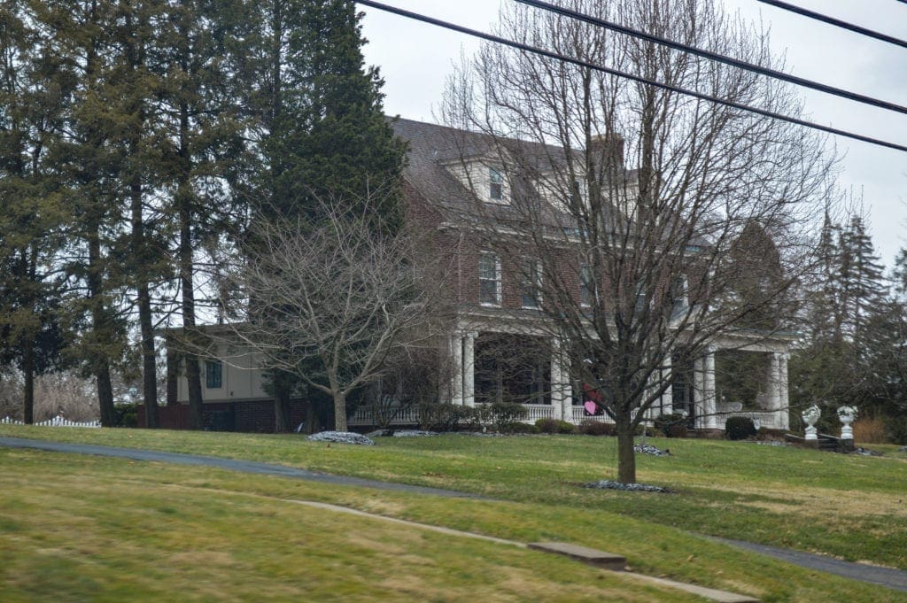 A big house along a highway.