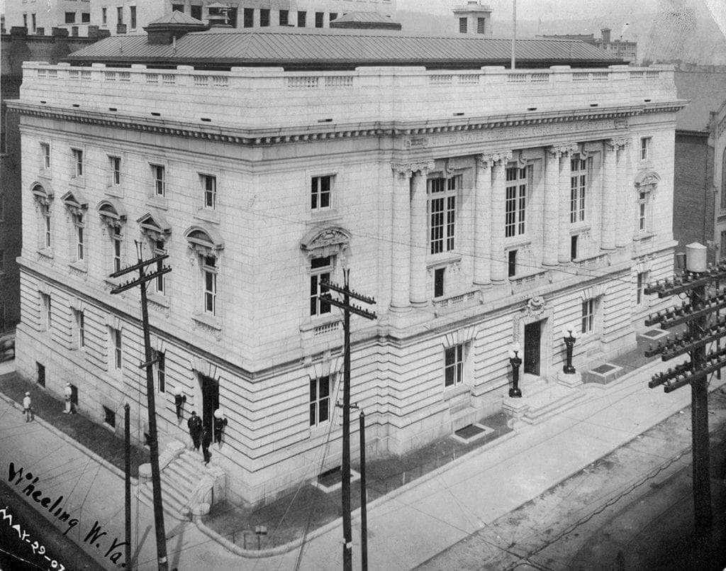 A black and white photo of a post office.