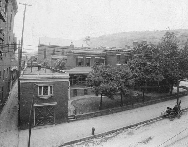 There is a horse and buggy in this historic photo.