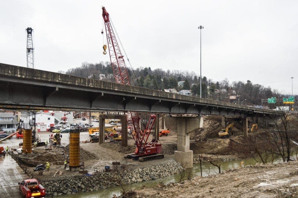 A photo of construction crews working on an interstate.