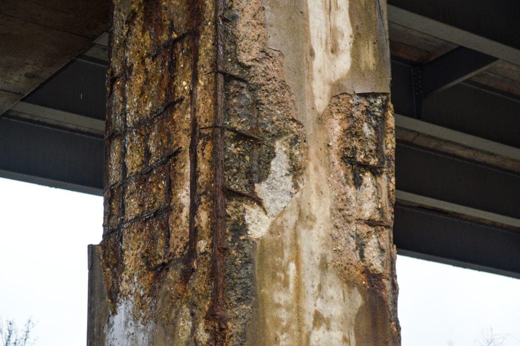 A photo of rotting interstate pier.