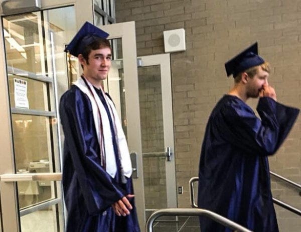 A photo of a young man in a commencement robe.