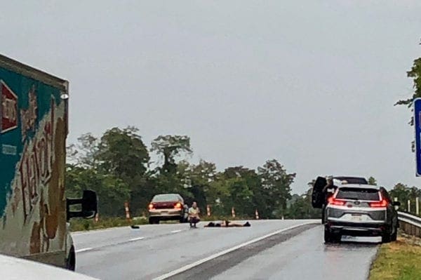 An image of someone dead on a roadway.