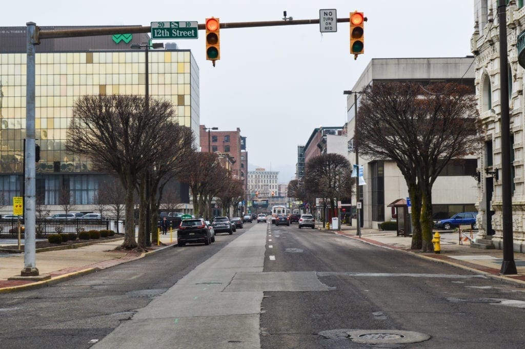 A photo of a street in a downtown.