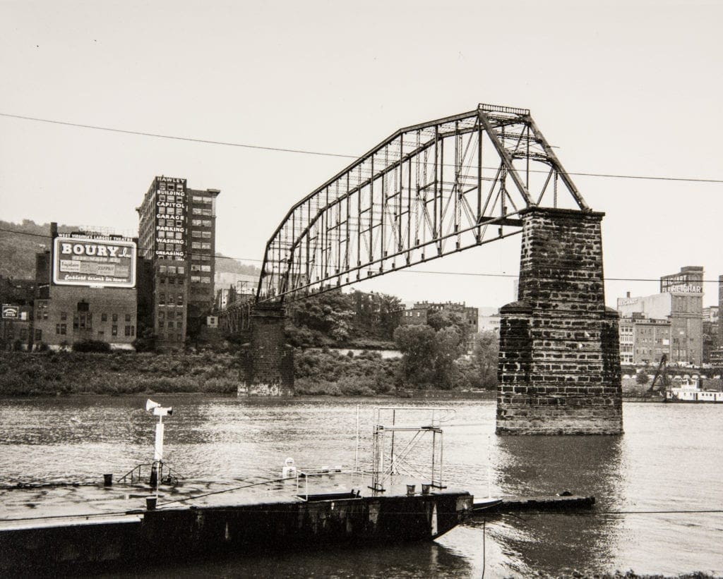 A photo of a bridge being demolished.