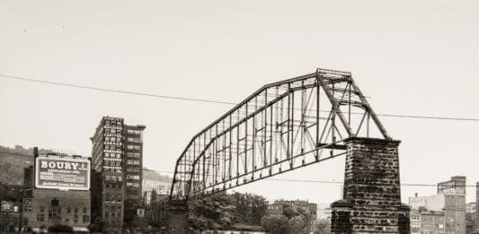 A photo of a bridge being demolished.