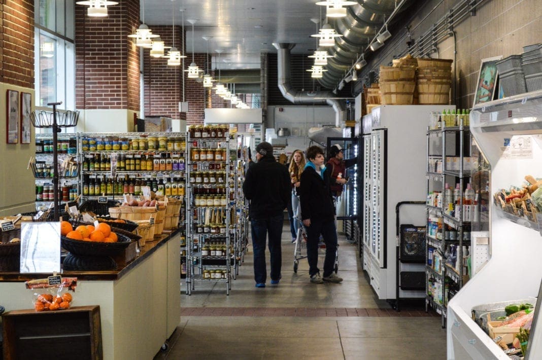 A photo of the length of a food market.