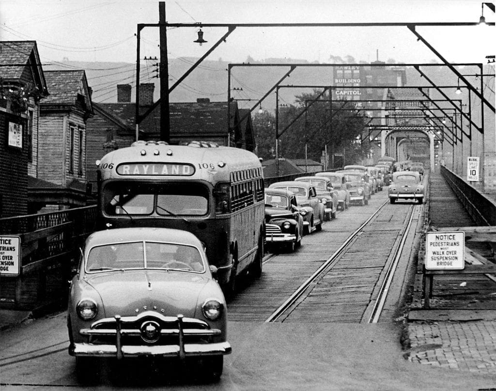 A photo of a lot of cars on a bridge.