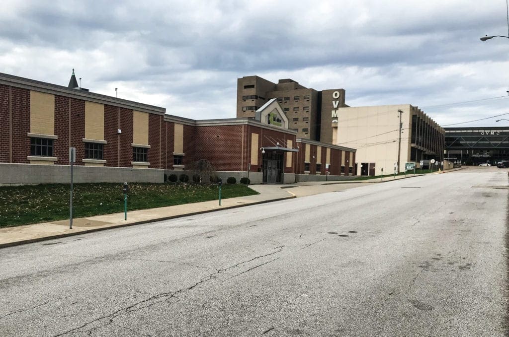 A photo of a long two-story building.