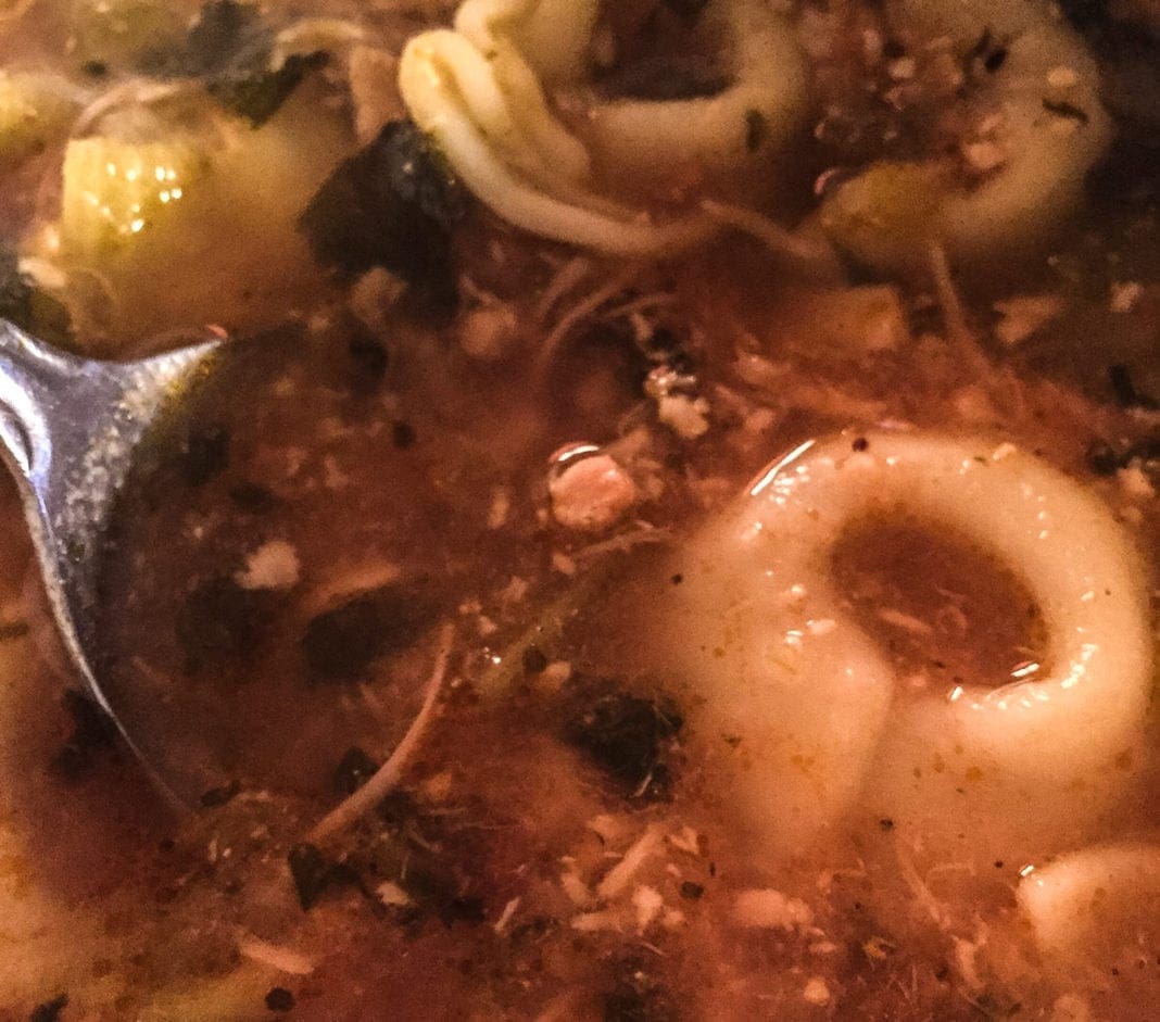 A close up photo of a bowl of soup.