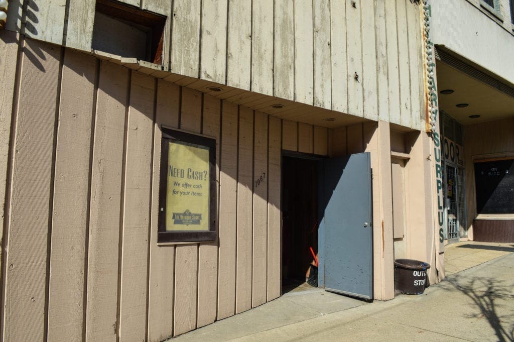 A photo of an old facade for a former night club.