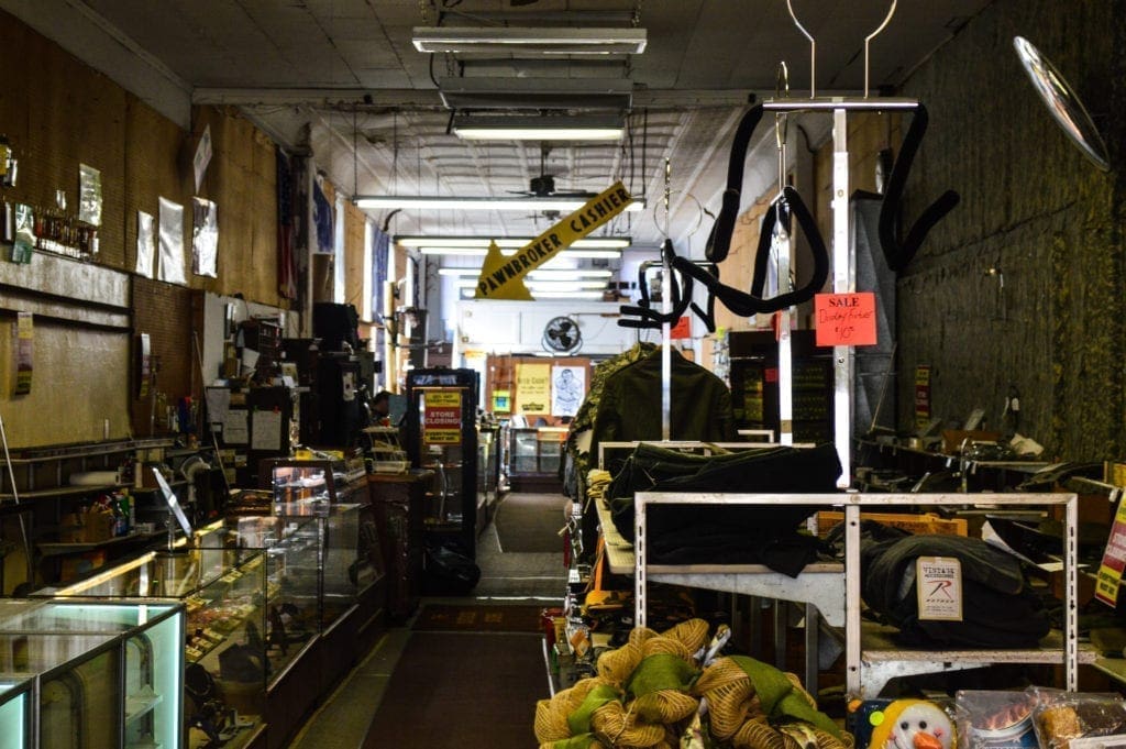 A long showroom in a slender building.