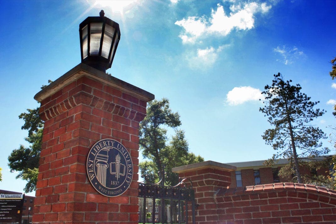 A photo of a gate to a university.