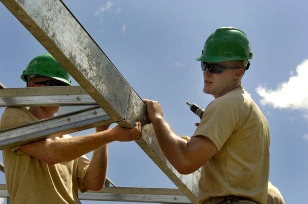 Construction workers installing a roof.