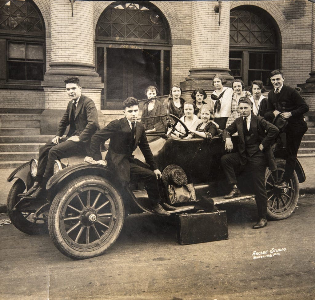 A photo of several students in a car.