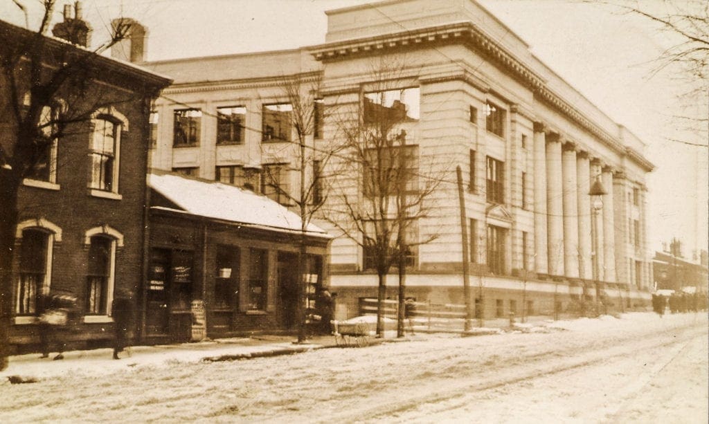 A photo of the side of an old school building.