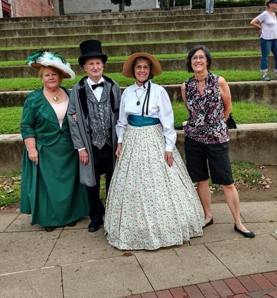 Ladies dressed in historical clothing.