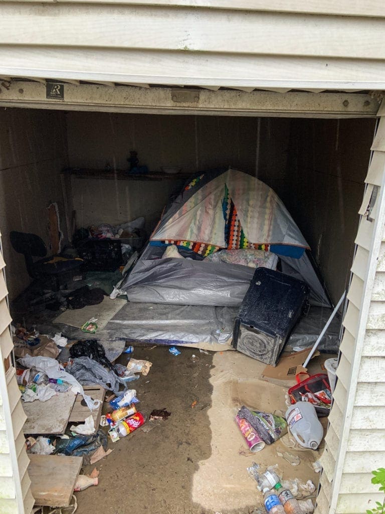 A photo of a tent inside a garage.