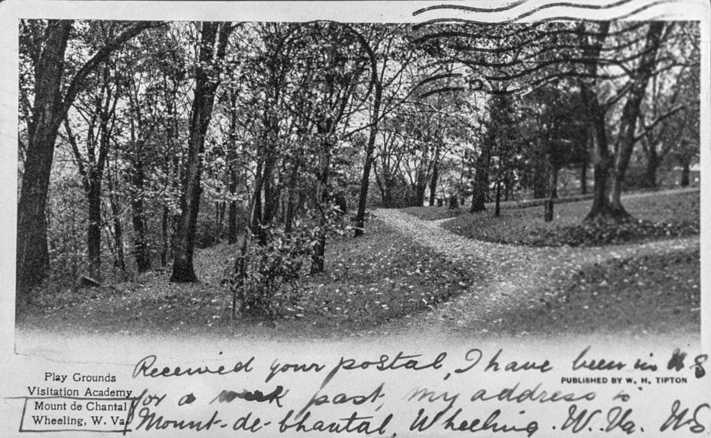 A postcard with a handwritten note.