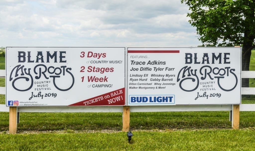 Two signs for a festival in 2019.