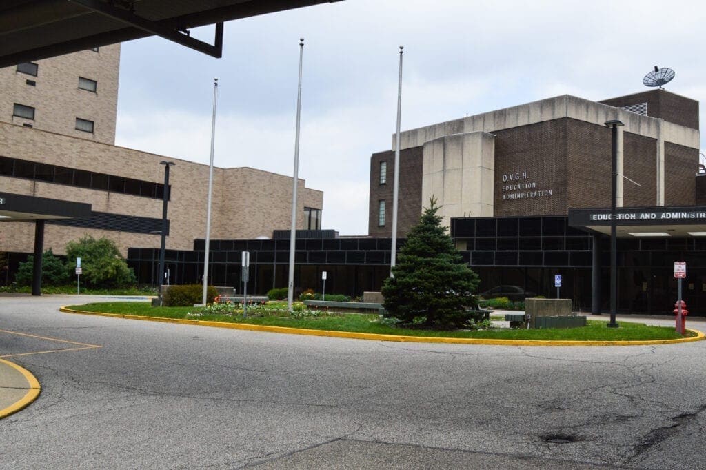 A photo of a plaza area near a hospital.