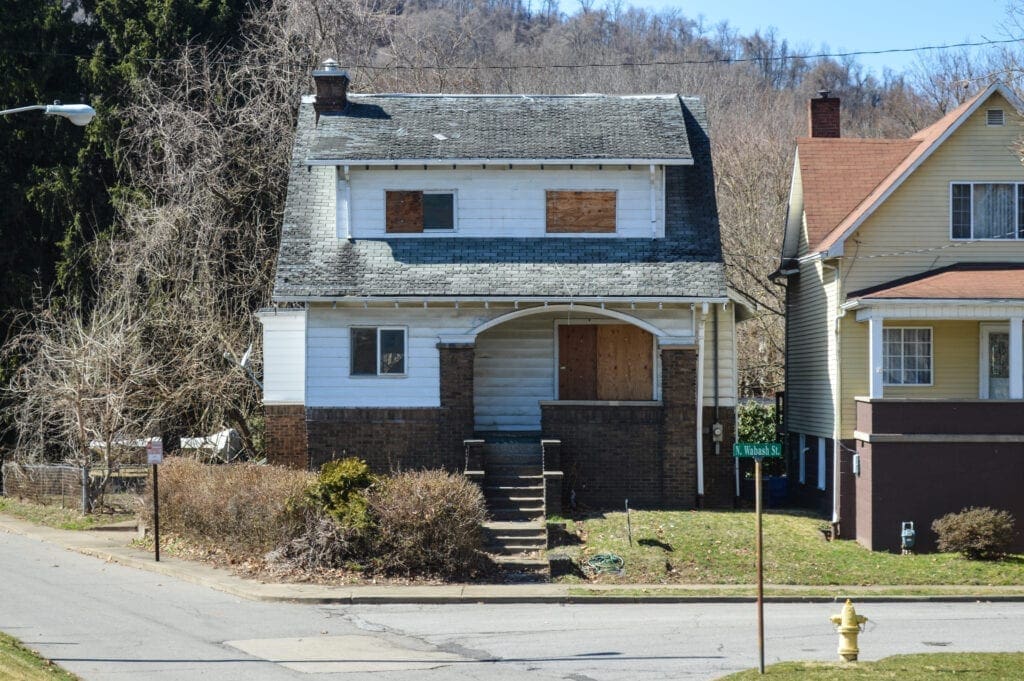 A house with play wood on the windows.