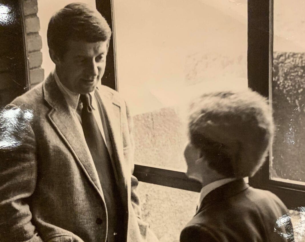 A young student speaker with a headmaster.